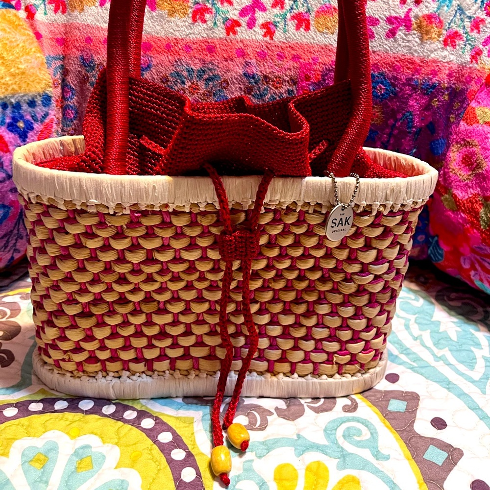 The SaK straw drawstring purse red and natural